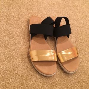 Gold and black strap sandals